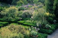 Butterstream, County Meath in Ireland. The white garden in summer with boxwood hedges and paths