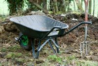 Wheelbarrow and well rotted compost