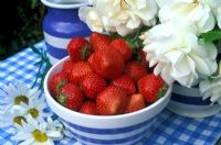 Summer Table - Bowl of strawberries, and jug of 'Iceberg' roses with Marguerite Daisies, in Cornish Kitchen Ware     