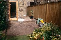 Before - back garden and side area between terraced houses in need of renovation - New fence erected - Patio and decking still to being laid - Elmsdale Road, London
