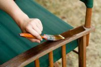 Painting wooden chair with oil to protect it