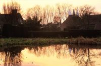 Reflections on the horsepond at Great Dixter at sunset