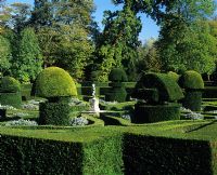 Formal topiary garden with statue