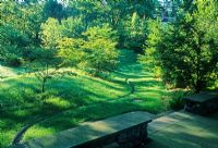 Land sculpting - Rill winding through undulating garden with dips and mounds covered with grass - The Healing Garden, Boston