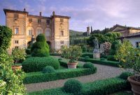Formal Italianate garden and house in atmospheric evening light - Villa Cetinale, Italy