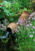 Small water feature with terracotta urns - The Schneider Garden, Bremen, Germany