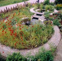 Circular ponds with bridge and poppies 