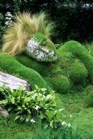 The 4head garden of dreams - RHS Chelsea Flower Show 2006 - Living grass sculpture of reclining nude woman with mirror tiles on half of face and Stipa tenuissima as hair 