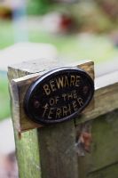 'Beware of the Terrier' garden signpost