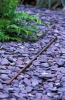 A path of slate chippings with steel retainers