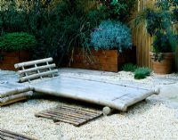 Roof garden with barleycorn gravel and bamboo chairs