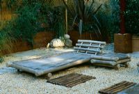 Roof garden with barleycorn gravel and bamboo chairs