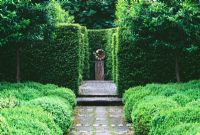 Vista along path to focal point with Buxus - Box balls and Taxus - Yew hedging, Design Tony Ridler