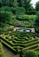 Low Buxus hedging maze parterre with central round pool - Hatfield House, Hertfordshire  