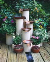 Water feature made from recycled hot water cylinders and gas mains