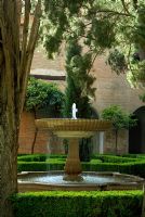 Fountain in a courtyard - Gardens of the Alhambra, Granada, Spain 