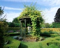 Bandstand with Humulus lupulus and Lonicera 'graham thomas'