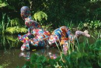 Sculpture in water called 'Are all Things Bright and Beautiful' made from coloured beads