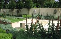 contemporary minimal garden with patio sculpture and perennial planting Chelsea 2002 