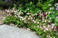 Raked gravel in tiny Japanese courtyard garden - 'East Wind' garden, Chelsea 2007 