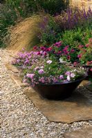 Conical containers with Summer bedding  