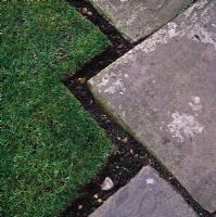 Decorative turf edging and old york stone paving