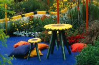 Sunflower chairs and table and blue silicone path in Fisher Price Childrens Garden, Hampton Court FS 