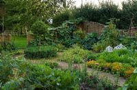 Vegetable garden with woven willow fence at Pannells Ash Farm West, Essex