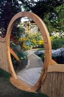 Circular moon gate and cobble path to gravel rock garden area - Feng Shui garden London 