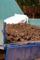 Top soil in the back of a trailer