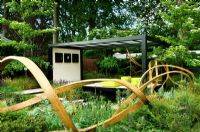 Three intertwined strands of curved oak in the 'Cancer Research UK Garden' - RHS Chelsea 2007