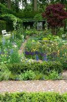 Mixed planting, paths and seat in 'The Daily Telegraph Garden' - Chelsea 2007
