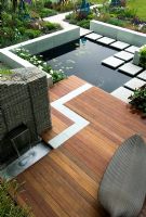 Overview of decked patio area beside water feature - 'The Marshall's Sustainability Garden', Chelsea 2007