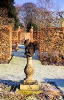 Tabby cat on sundial in winter - Wollerton Old Hall, Shropshire 