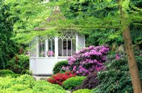 Pavillon in garden with Rhododendrons