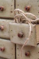 Natural jute garden twine in small rustic set of drawers