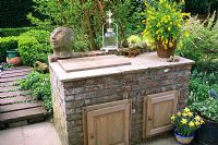 Outdoor kitchen with cupboards made from brick 