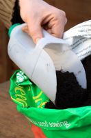 Making a scoop out of a recycled milk carton