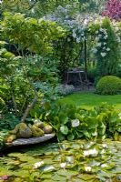 Garden pond with reclining sculpture