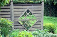 Wooden fence with trellis hole