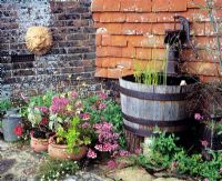 Water feature and pots, hand pump in barrel