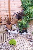 Dry gravel area with oriental feel, mixed materials and pots - Nailsea, Somerset, UK 
