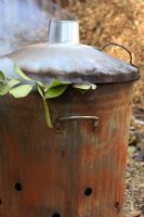 Metal incinerator in use - Burning garden waste