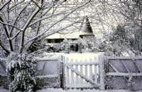 The Oast Houses, Hampshire - View through garden gate in snow