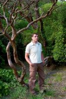 Man stood beside tree - Kilruddery Garden in County Wicklow