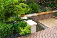 A water rill, pool and sunken seating area in a courtyard garden surrounded by planting of mixed perennials, shubs, herbs and grasses - Garden - A Welcome Sight Garden, Design - Adam Frost - Best Urban Garden, Gold Medal Winner