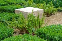 Cubes of Buxus sempervirens, ferns and quarried stone in The Reflective Garden, Design - Clare Agnew Design, Sponsor - Ruffer LLP