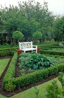 Formal Potager with painted white seat