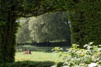 Garden view with horse in field - Cranborne Manor Gardens