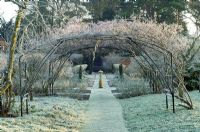 Frosty winter garden with arch and sundial as focal point - Spencers, Great Yeldham, Essex